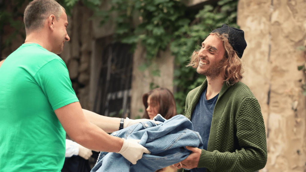 Volunteer Helping a Homeless Drug Addict in Recovery.